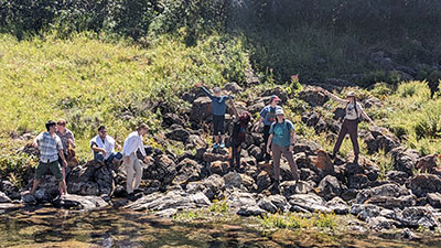 2023 cohort at Taft Nicholson Center cavorting on a river bank
